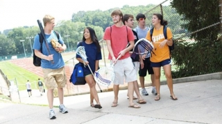 group of teens with sports equipment