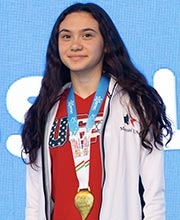 Maia wearing a gold medal