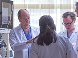 Fetal doctors talking in lab