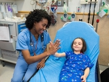 Doctor giving a high-five to a patient