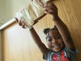 Child holding a sandwich