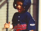 young roberto playing baseball