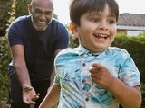 Chasing grandson in the garden during outdoors playtime.