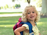 Maeve with her school backpack