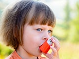 little girl with inhaler