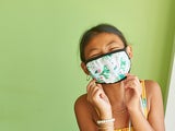 Young girl wearing a protective mask