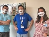 Staff wearing window facemasks