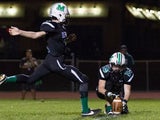 Sean kicking a football