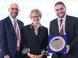 People holding an award