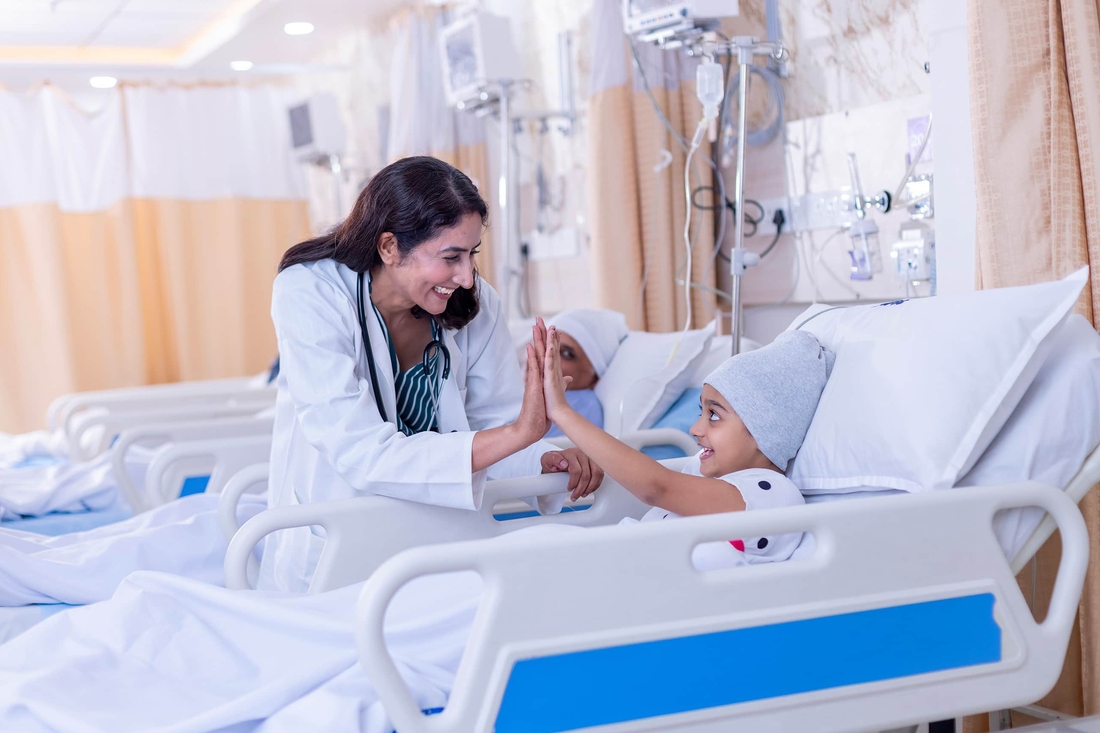 Physician high-fiving her patient