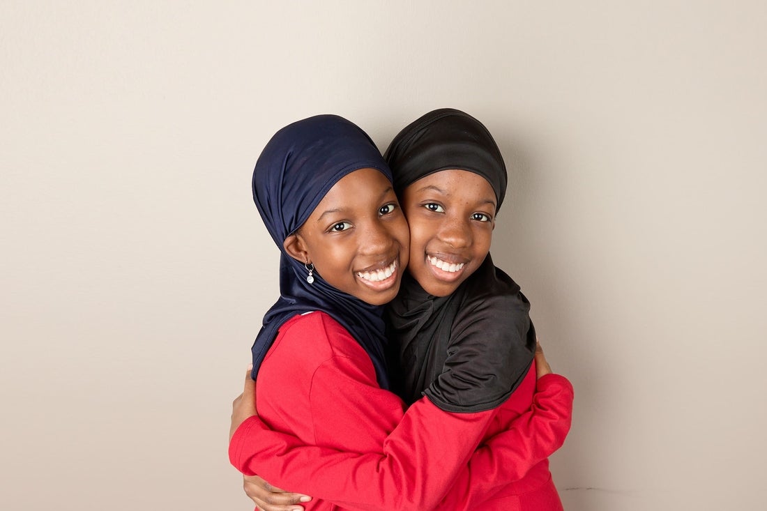 two sisters hugging