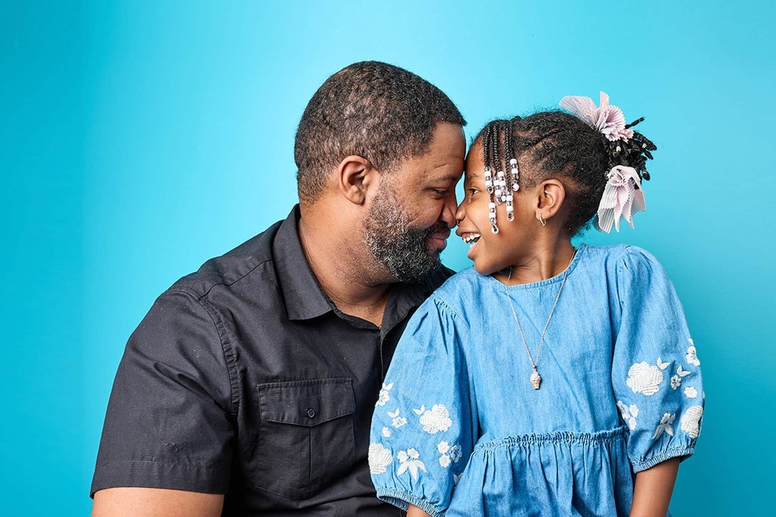 Father and daughter rubbing noses