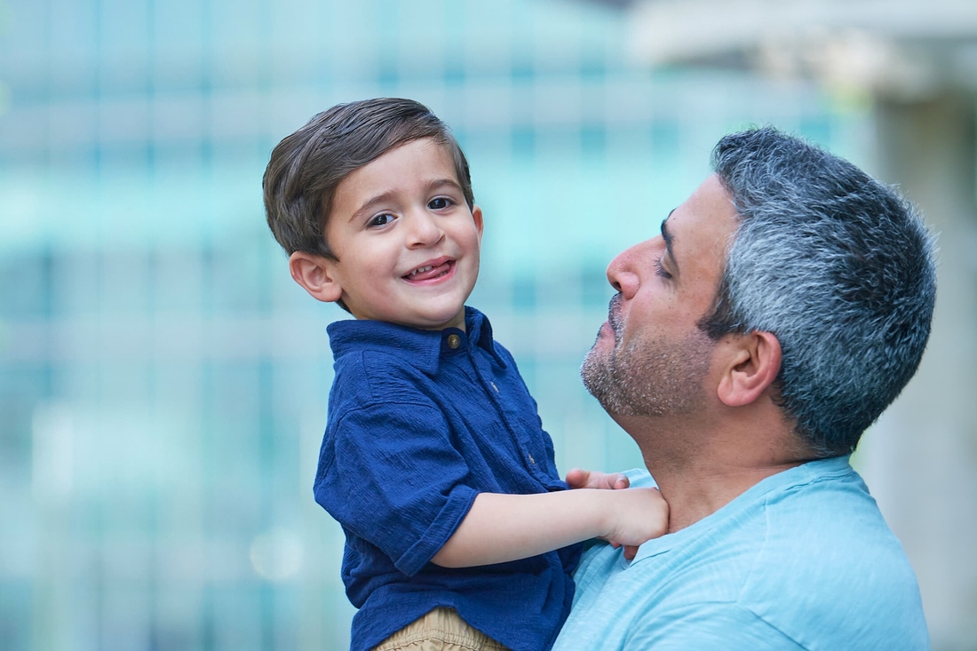 Dad and young boy who is part of Cleft Lip and Palate Program.