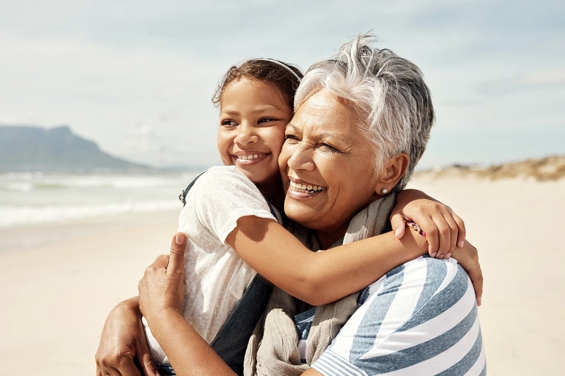 Grandmother hugging granddaughter