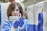 Researcher wearing protective gear in research lab