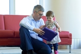 Doctor showing something on a tablet to a young girl