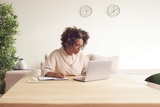 Mother researching on the computer