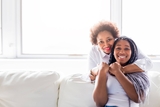 mother hugging her teen daughter