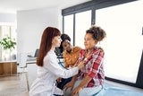 physican examining teen with stethoscope