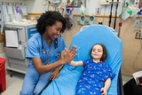 Doctor giving a high-five to a patient