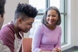 Mother smiling at teenage son