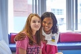 Nephrology team member placing her hands on the shoulders of one of her patients