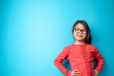 Young girl wearing glasses and smiling