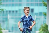 Young boy running with cleft lip.