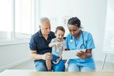 Physician testing a young patient's neurodevelopmental skills.