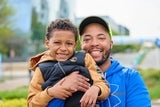 Father and son hugging outside