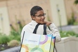 Teenaged CHOP patient holding shopping bag