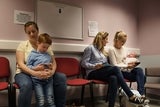 Moms with children in pediatric waiting room