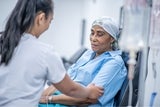 Nurse comforting cancer patient