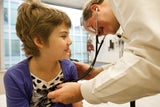 Young girl getting a medical exam