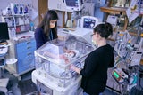 Premature baby in artificial womb device