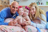 Conjoined twins, Lily and Addy, with their parents