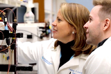 CIGT staff reviewing information in a medical laboratory