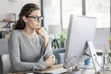 Woman sitting at computer