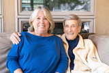 Smiling couple sitting on a couch