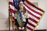 Alice with Eagle Scout badges