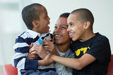 Mom with 2 sons smiling