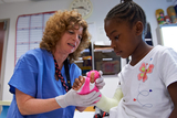 girl having cast applied to arm