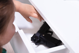 little girl reaching for gun in drawer