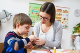 Teacher with child in classroom