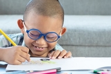 Young boy drawing a picture