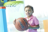 Young boy holding a basketball