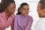 Doctor talking to patient and mother