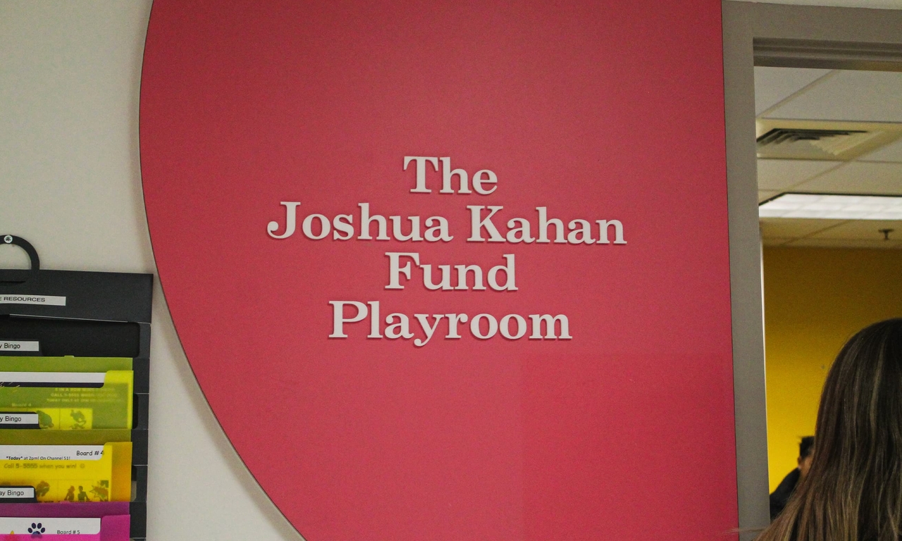 The Joshua Kahan Fund Playroom sign