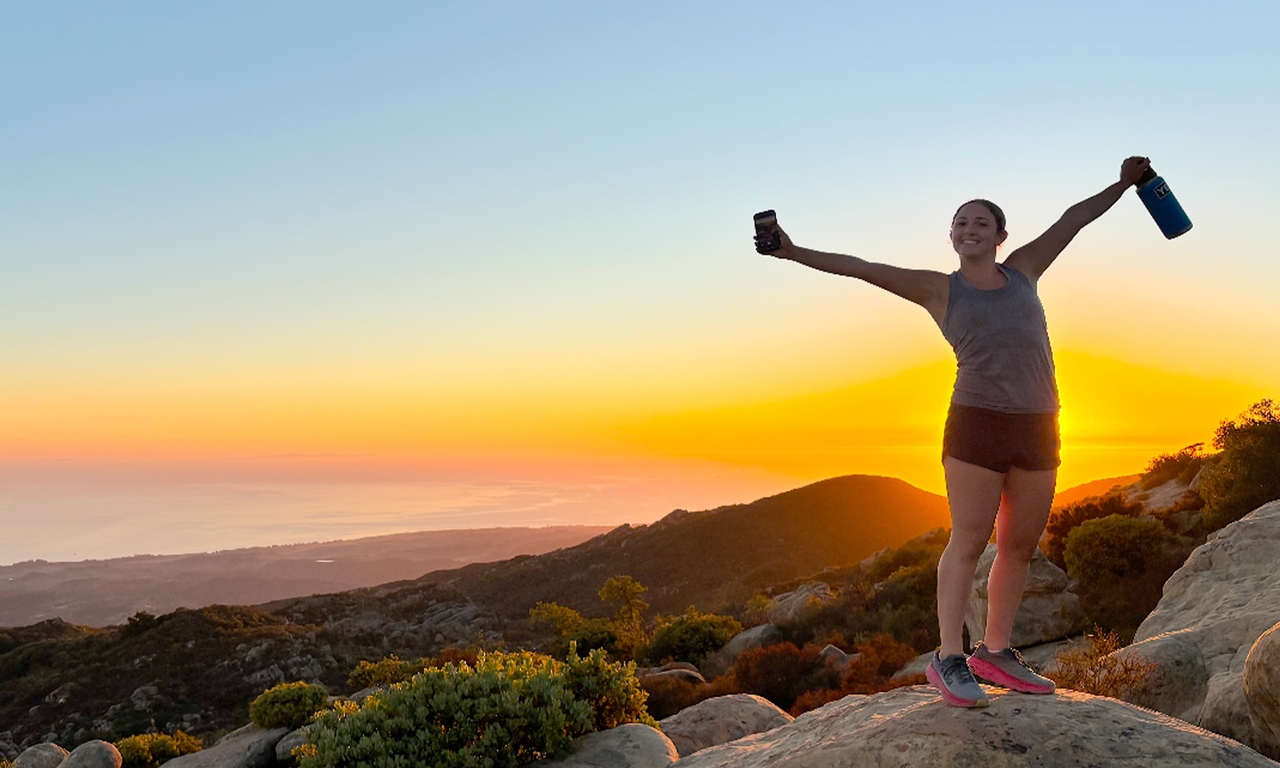 Amanda climbing at sunset