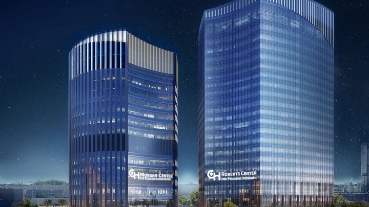 Rendering of two office towers with night sky